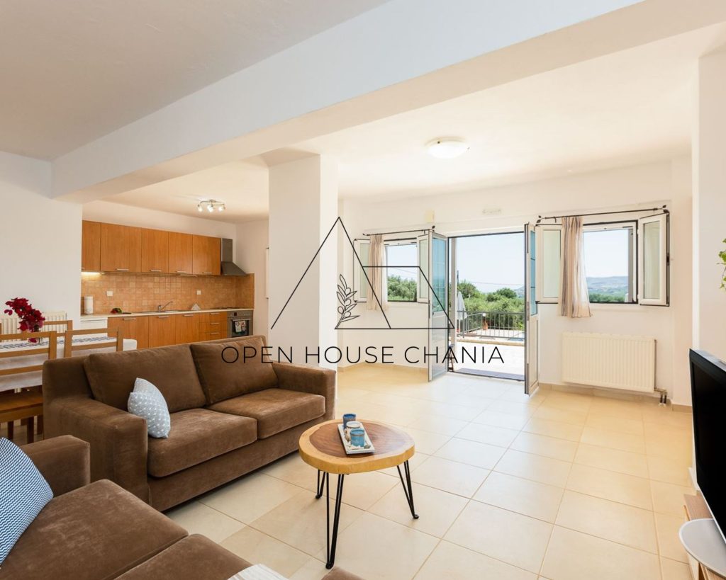 A three-level villa with a tennis court in Kournas