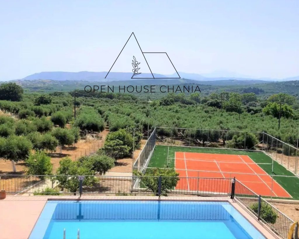 A three-level villa with a tennis court in Kournas