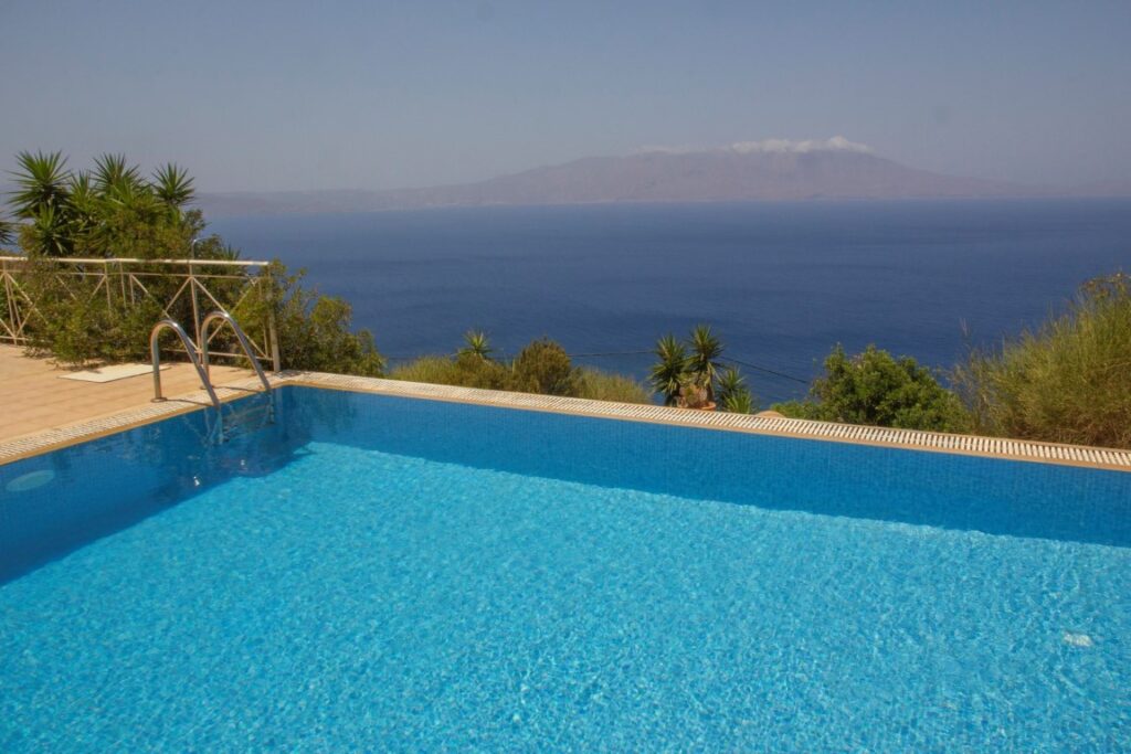 A VILLA PERCHED ON THE SEAFRONT HILLSIDE OF RAVDOUCHA