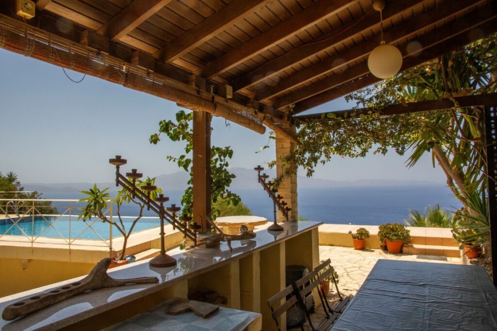 A VILLA PERCHED ON THE SEAFRONT HILLSIDE OF RAVDOUCHA