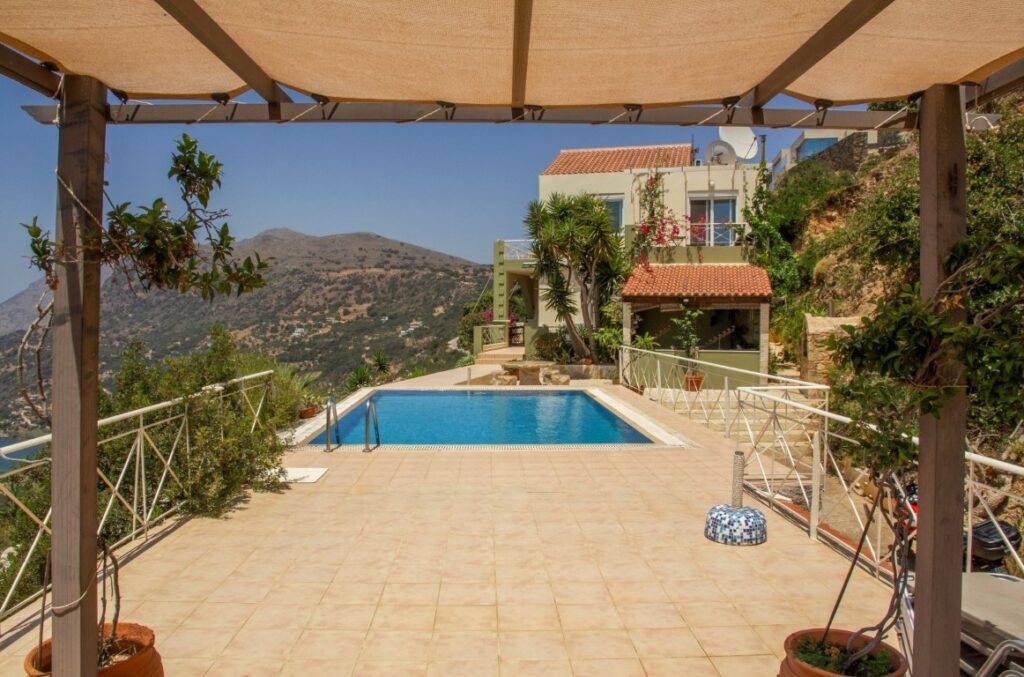 A VILLA PERCHED ON THE SEAFRONT HILLSIDE OF RAVDOUCHA