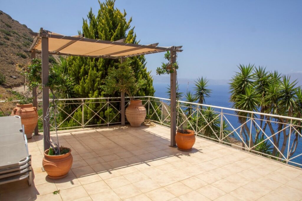 A VILLA PERCHED ON THE SEAFRONT HILLSIDE OF RAVDOUCHA