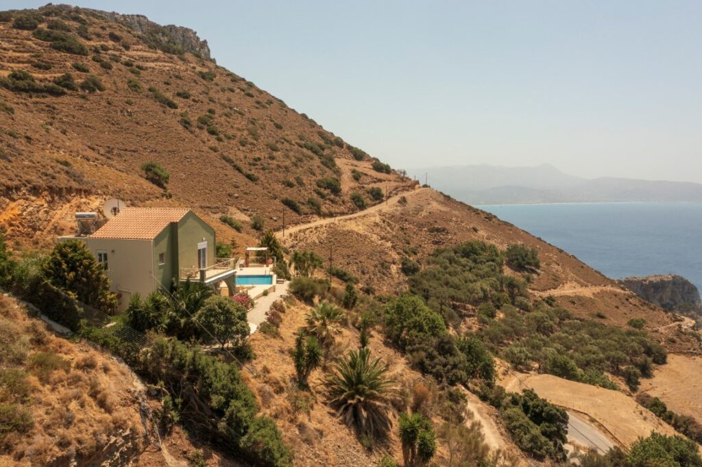 A VILLA PERCHED ON THE SEAFRONT HILLSIDE OF RAVDOUCHA