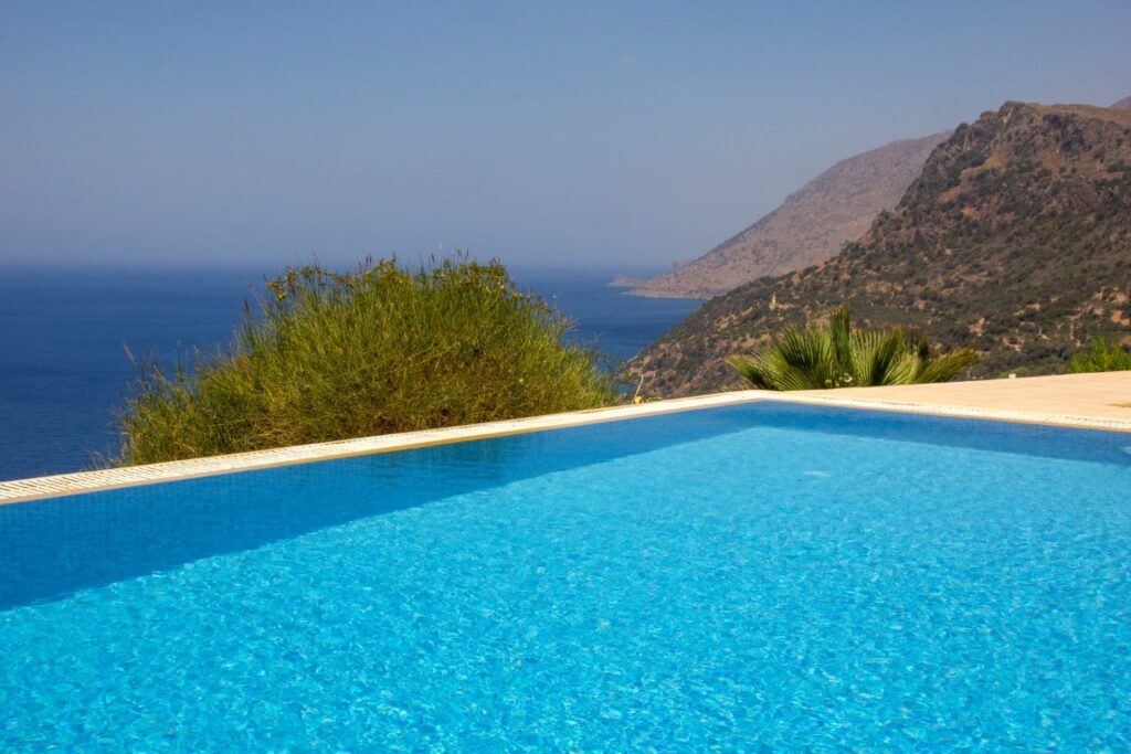 A VILLA PERCHED ON THE SEAFRONT HILLSIDE OF RAVDOUCHA