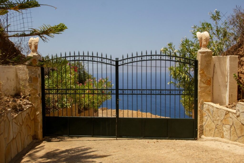 A VILLA PERCHED ON THE SEAFRONT HILLSIDE OF RAVDOUCHA