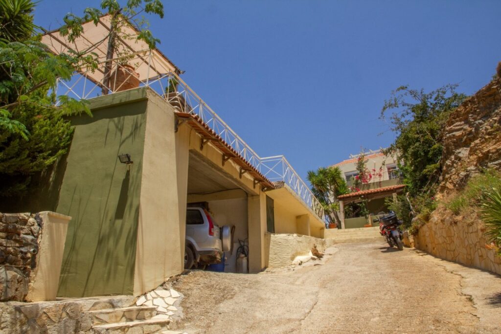 A VILLA PERCHED ON THE SEAFRONT HILLSIDE OF RAVDOUCHA