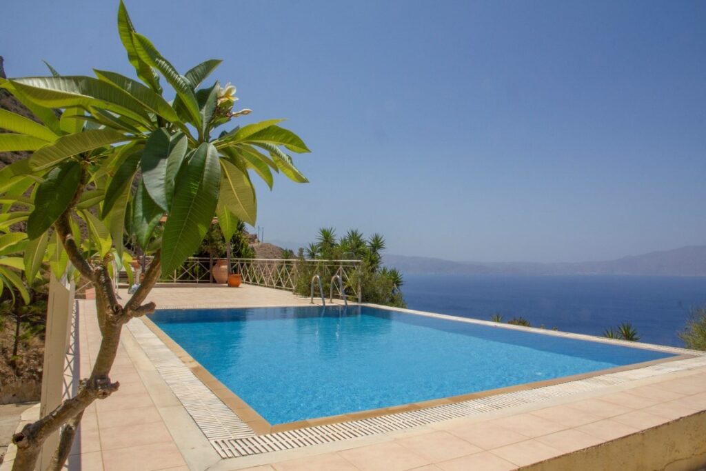 A VILLA PERCHED ON THE SEAFRONT HILLSIDE OF RAVDOUCHA