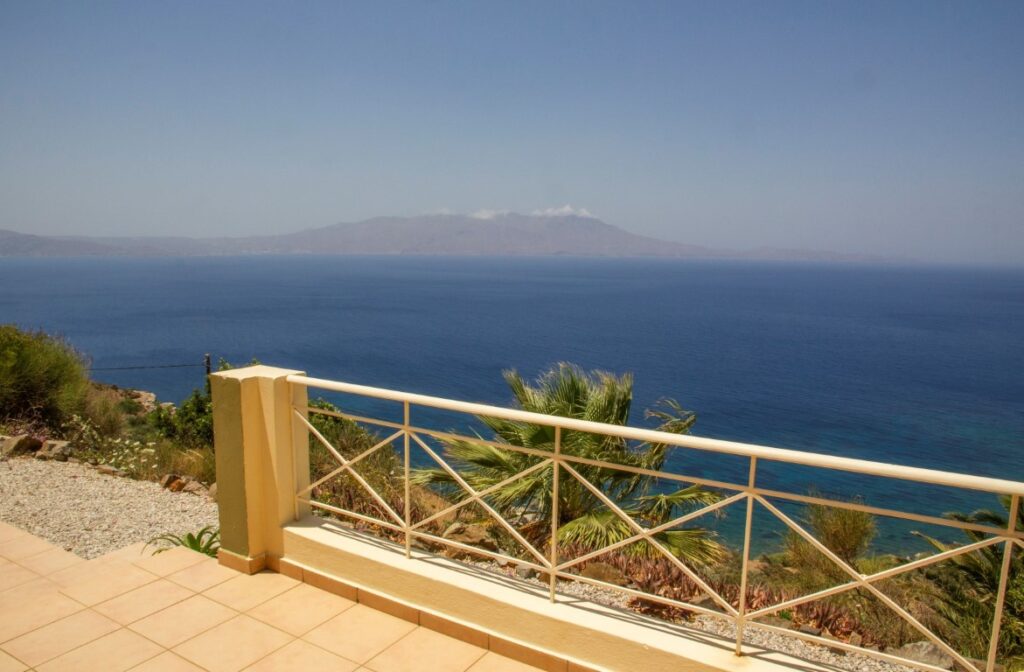 A VILLA PERCHED ON THE SEAFRONT HILLSIDE OF RAVDOUCHA