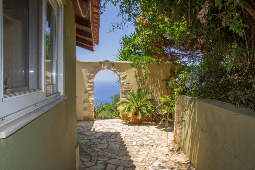 A VILLA PERCHED ON THE SEAFRONT HILLSIDE OF RAVDOUCHA