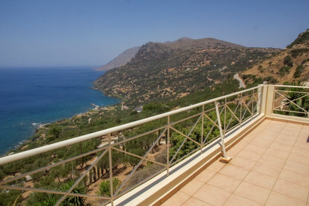 A VILLA PERCHED ON THE SEAFRONT HILLSIDE OF RAVDOUCHA