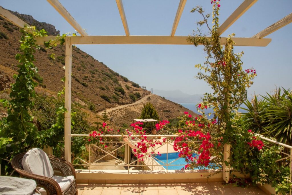 A VILLA PERCHED ON THE SEAFRONT HILLSIDE OF RAVDOUCHA