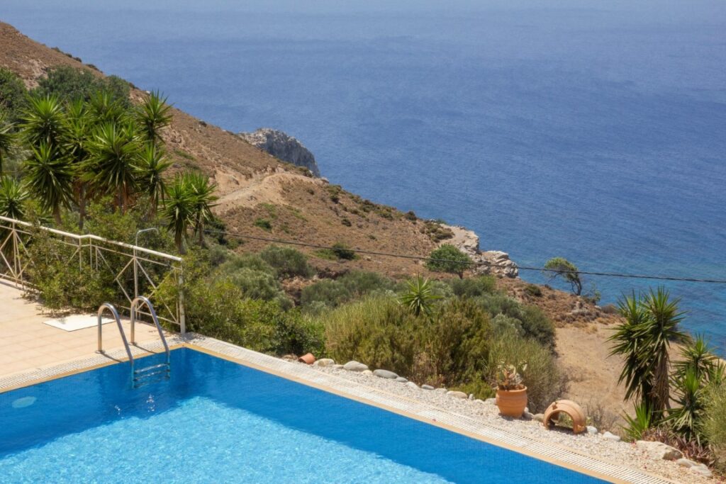 A VILLA PERCHED ON THE SEAFRONT HILLSIDE OF RAVDOUCHA