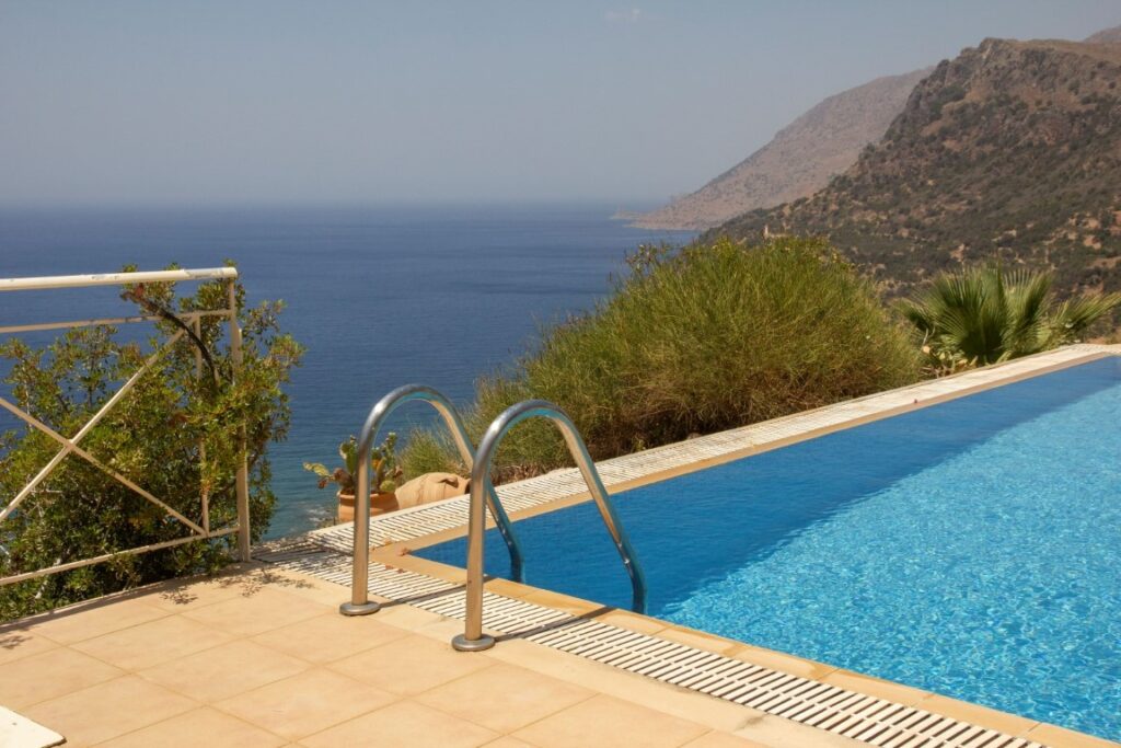 A VILLA PERCHED ON THE SEAFRONT HILLSIDE OF RAVDOUCHA