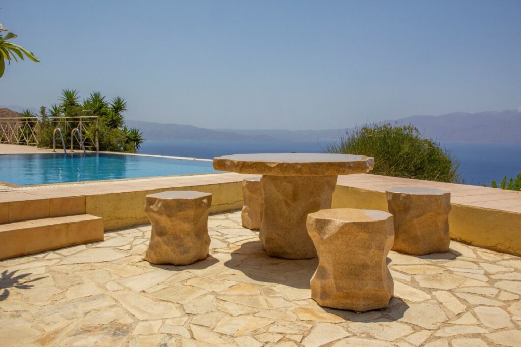 A VILLA PERCHED ON THE SEAFRONT HILLSIDE OF RAVDOUCHA