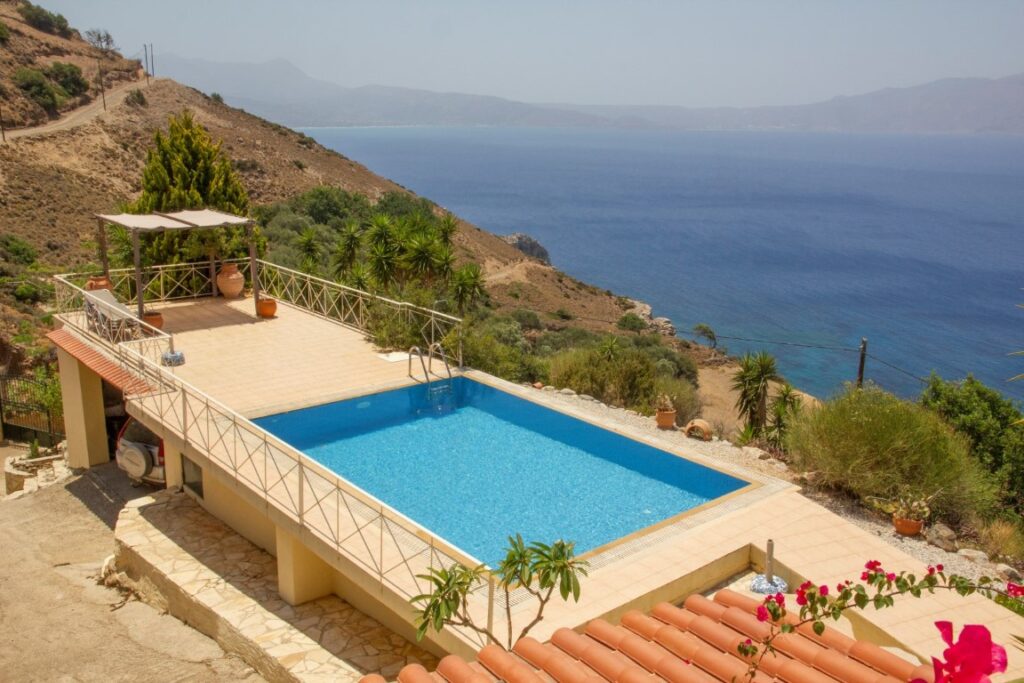 A VILLA PERCHED ON THE SEAFRONT HILLSIDE OF RAVDOUCHA