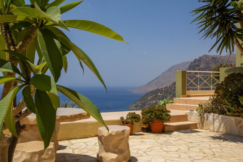 A VILLA PERCHED ON THE SEAFRONT HILLSIDE OF RAVDOUCHA