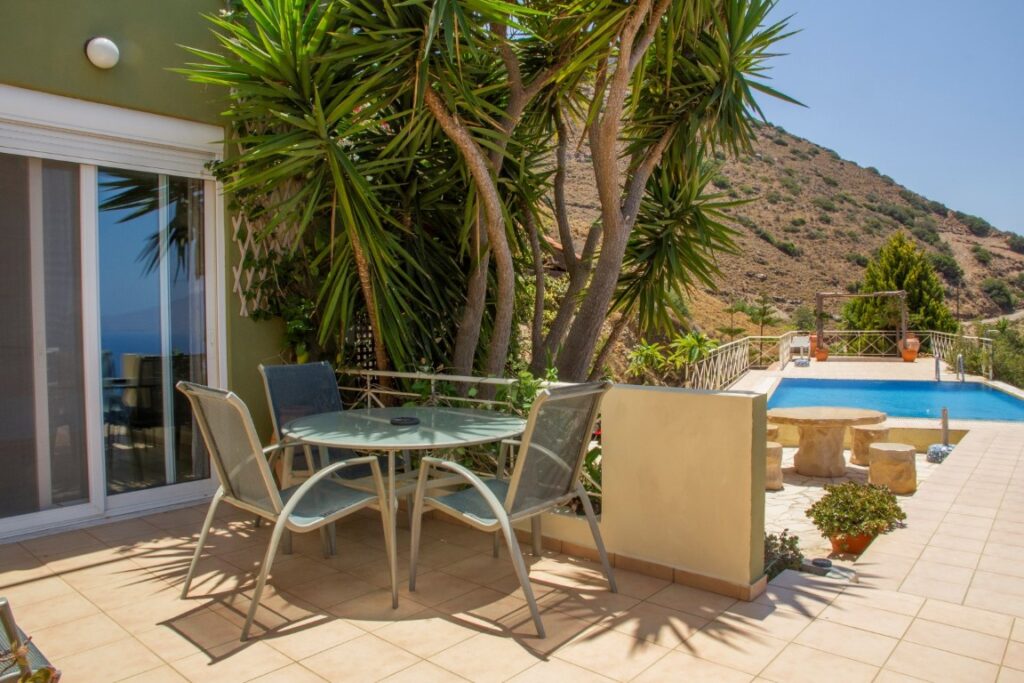 A VILLA PERCHED ON THE SEAFRONT HILLSIDE OF RAVDOUCHA