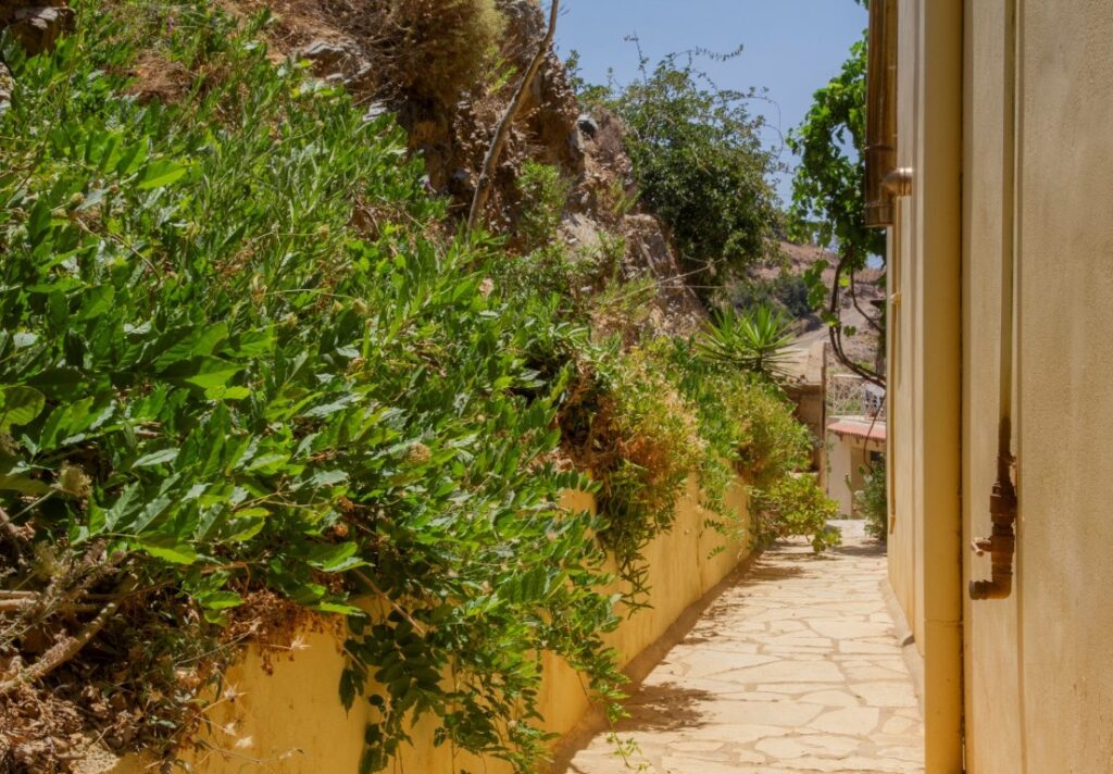 A VILLA PERCHED ON THE SEAFRONT HILLSIDE OF RAVDOUCHA