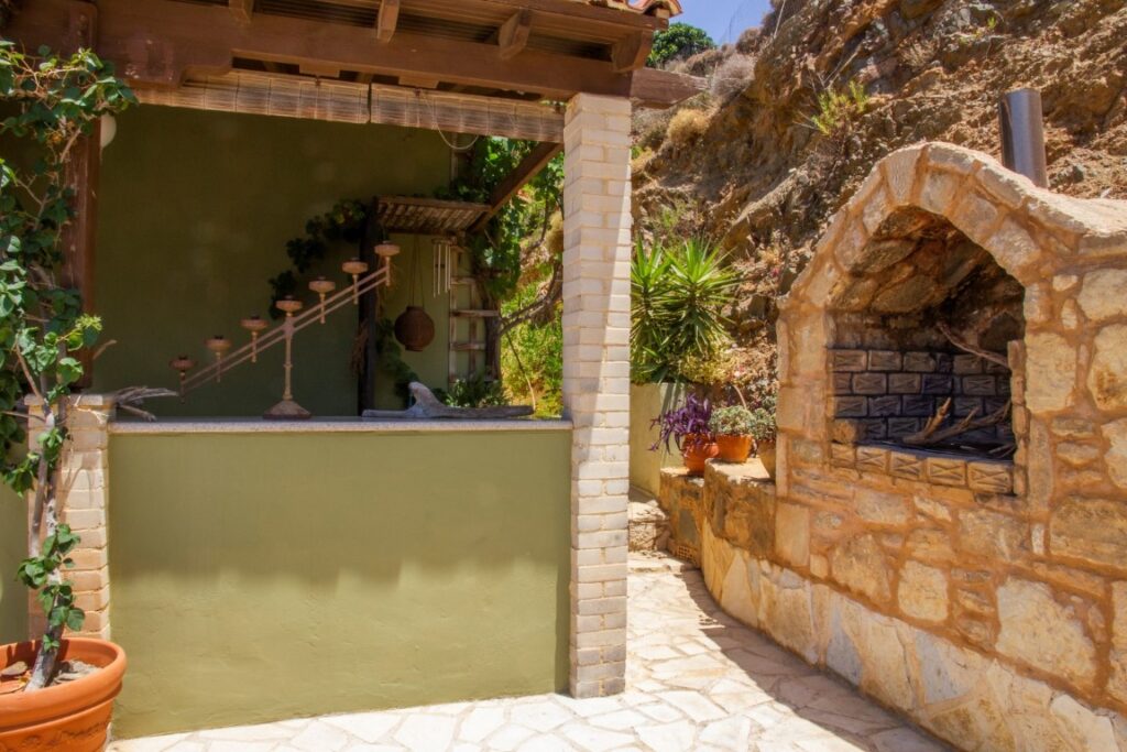 A VILLA PERCHED ON THE SEAFRONT HILLSIDE OF RAVDOUCHA