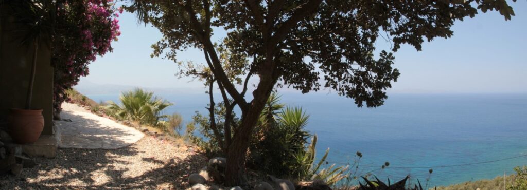 A VILLA PERCHED ON THE SEAFRONT HILLSIDE OF RAVDOUCHA